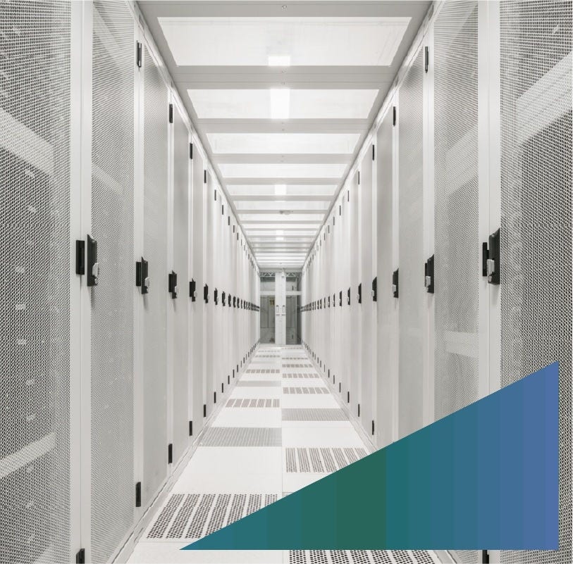 Aisle in a network server room where servers are locked behind grated doors